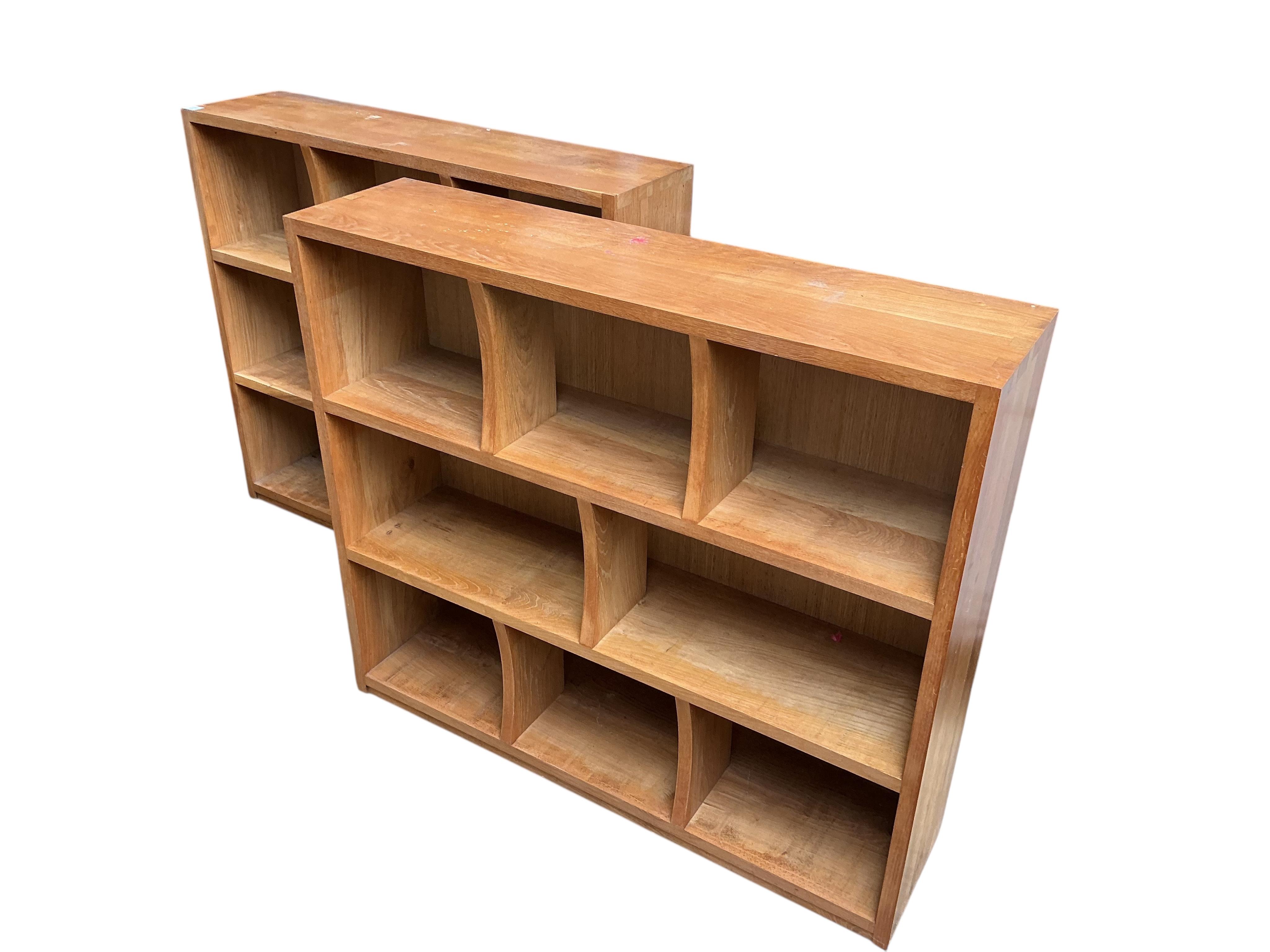 A pair of bespoke oak open bookcases, each width 132cm, depth 30cm, height 107cm